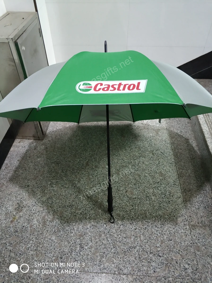 Green and white Castrol branded umbrella