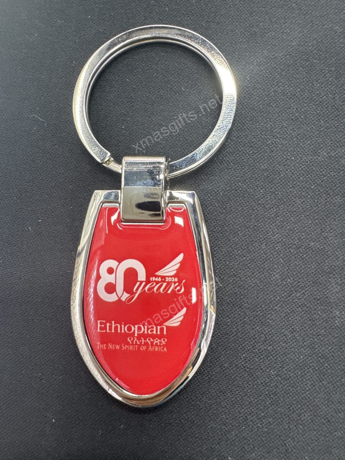 Metal keychain with epoxy dome 80th logo