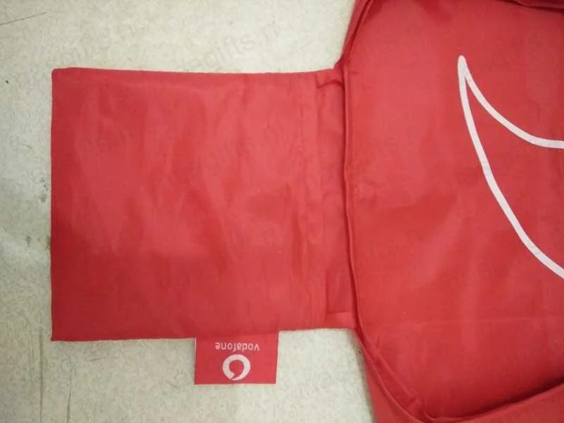 Folded Vodafone grocery bag showing logo detail
