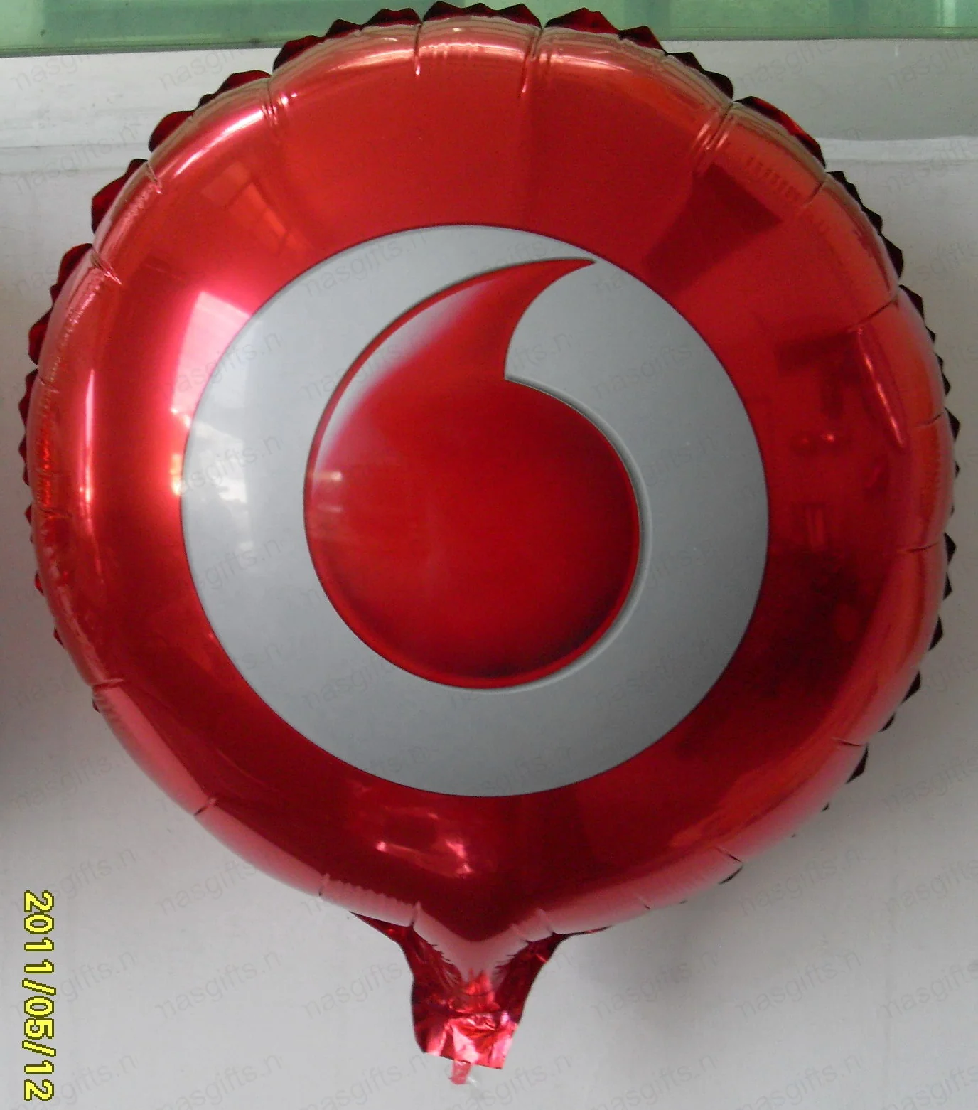 Vodafone red foil balloon with white speechmark logo